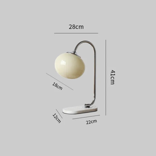 Skumfidus bordlampe i metal og glas